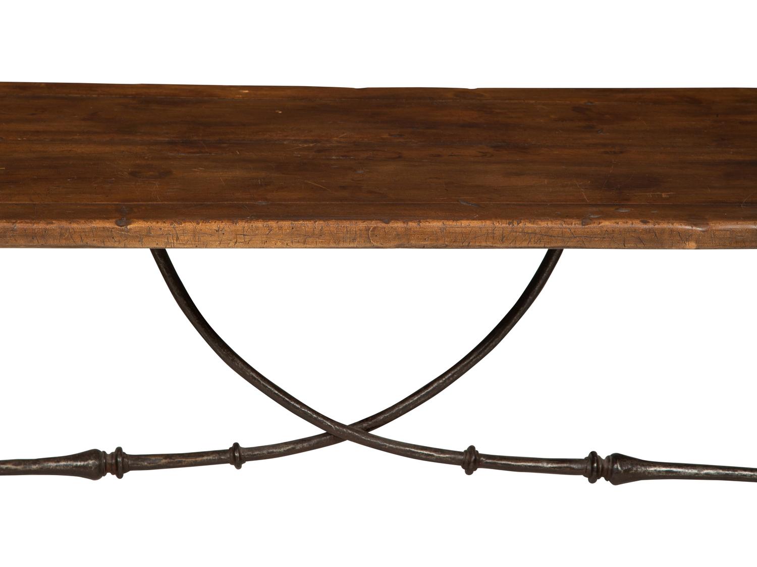 A Spanish Walnut and Wrought Iron Trestle Table