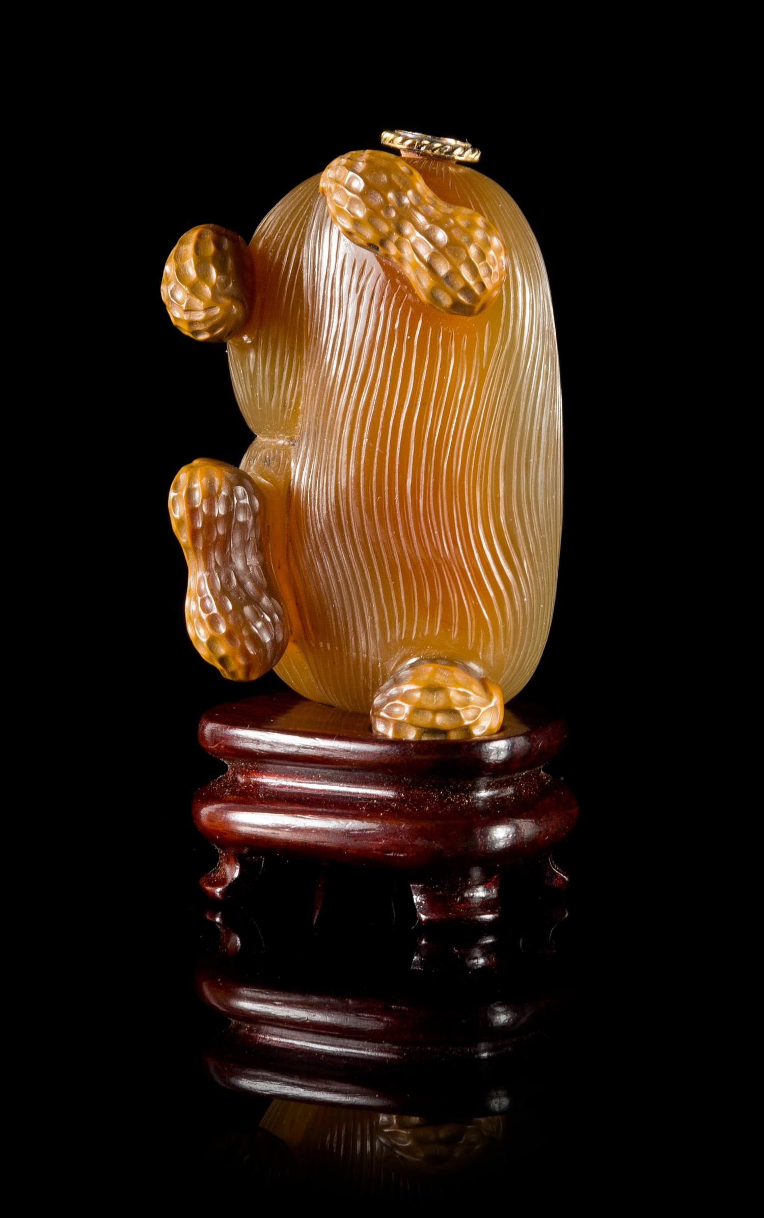 A Carved Agate Snuff Bottle Height 2 1/2 inches. — 19TH CENTURY