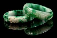 Two Chinese Apple Green and Pale Celadon Jadeite Bangles