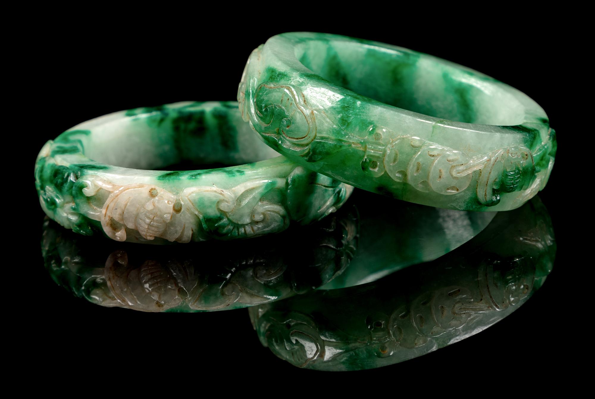 Two Chinese Apple Green and Pale Celadon Jadeite Bangles