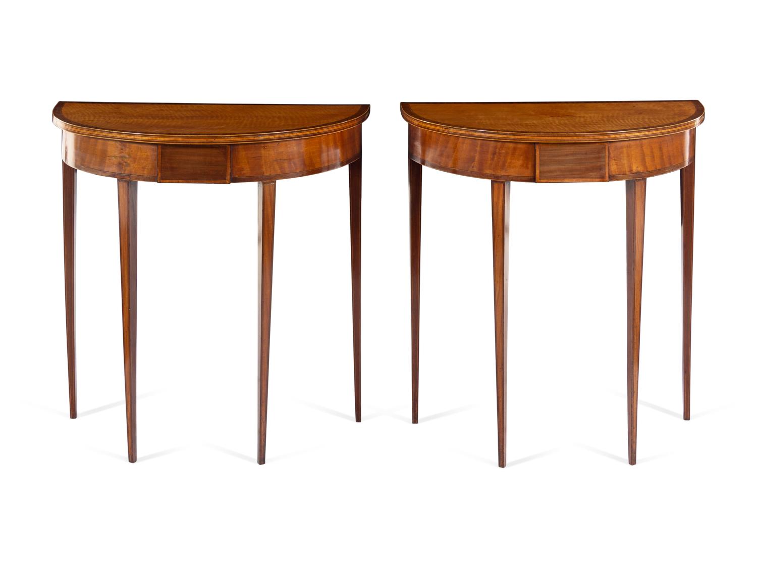A Pair of Regency Satinwood and Mahogany Demilune Console Tables