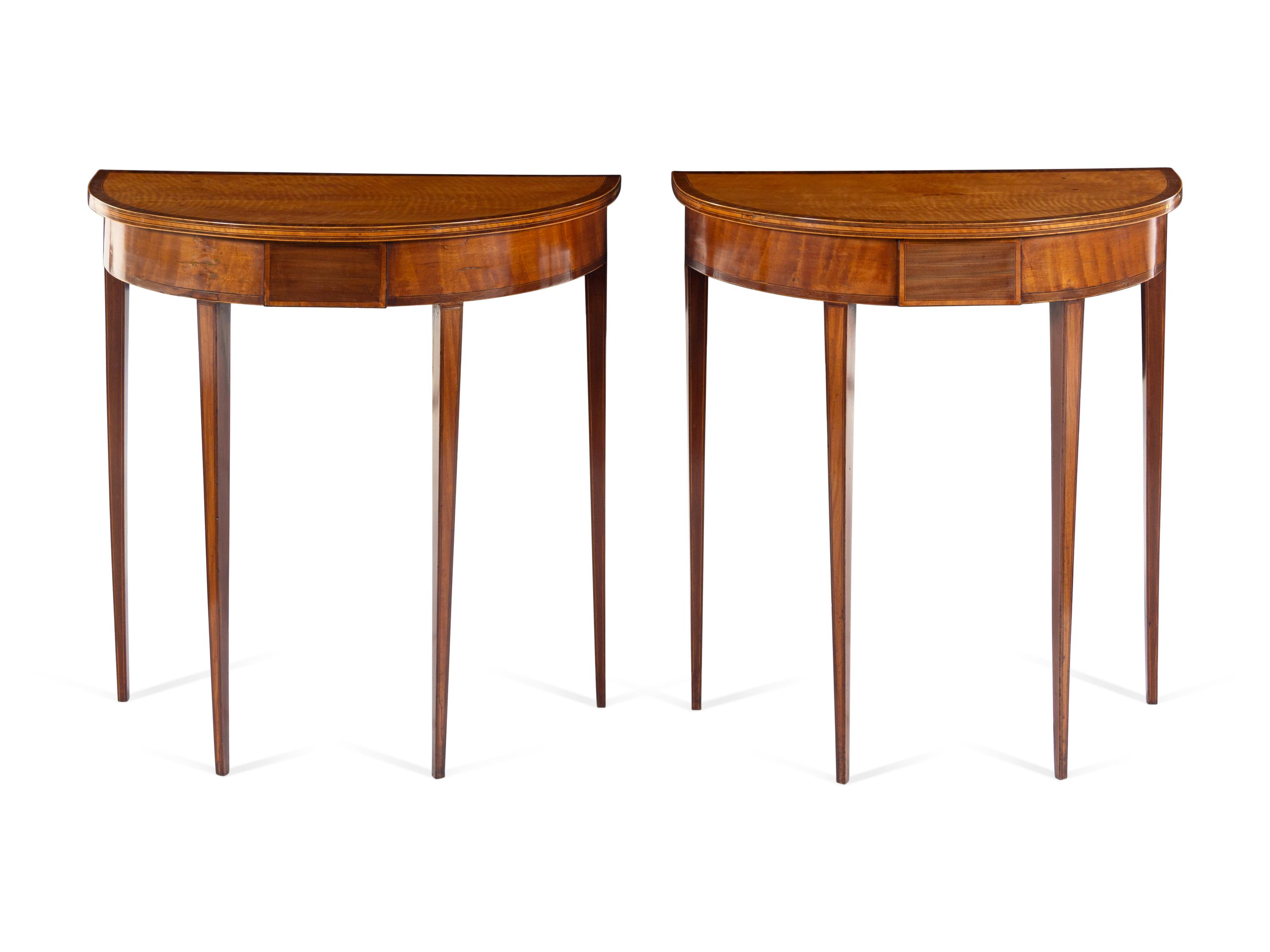 A Pair of Regency Satinwood and Mahogany Demilune Console Tables