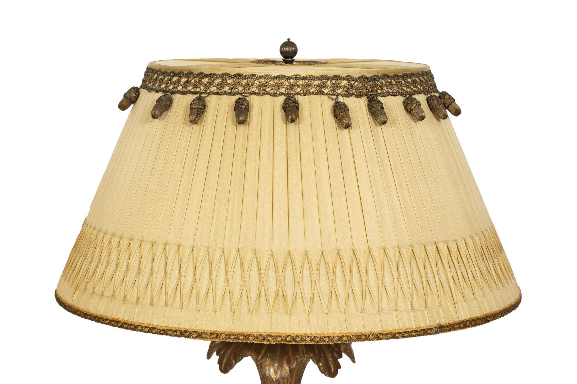 A Pair of XVI Style Carved Giltwood Lamps on Ebonized Pedestal Bases