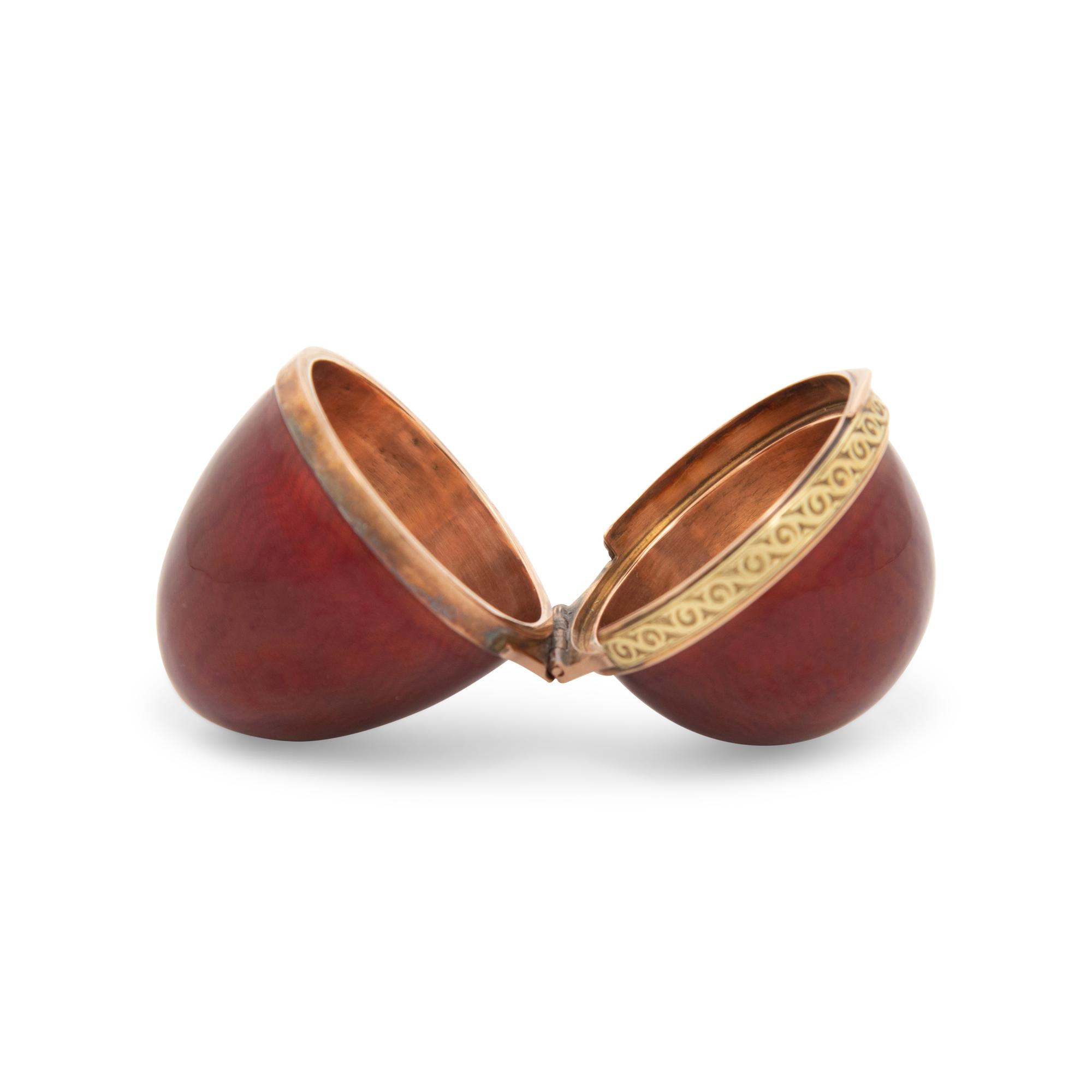 A Gold and Guilloché Enamel Egg-Form Snuff Box