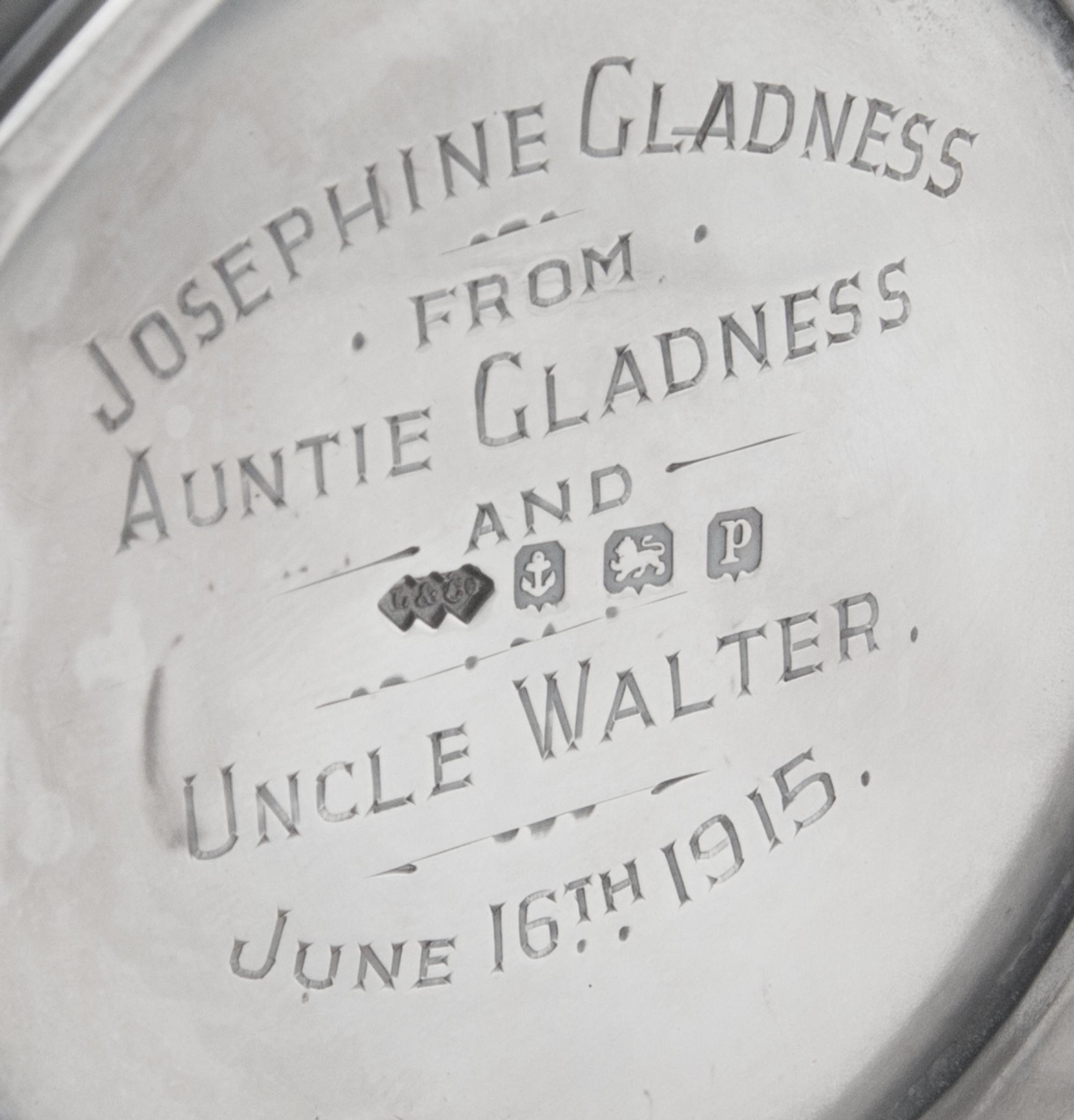 A George V Silver Mug, Liberty & Co., Birmingham, 1914, in the Arts & Crafts taste, with spot-hammered surfaces and stylized chased che