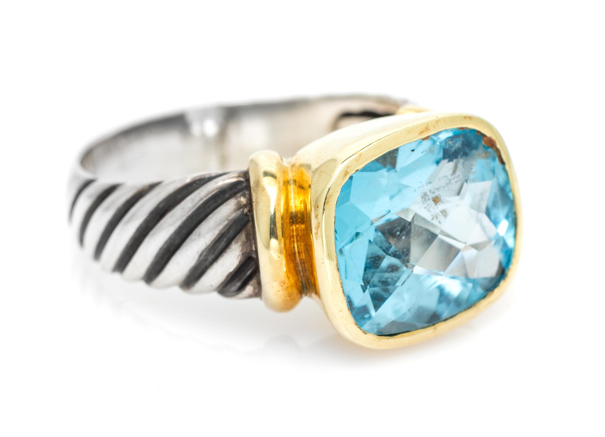 A Sterling Silver, 14 Karat Yellow Gold and Blue Topaz 'Noblesse' Ring, David Yurman, 7.50 dwts.