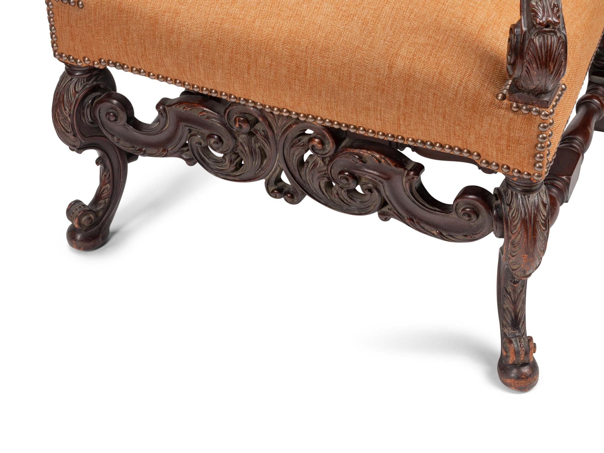 A Pair of William and Mary Style Carved Walnut Armchairs