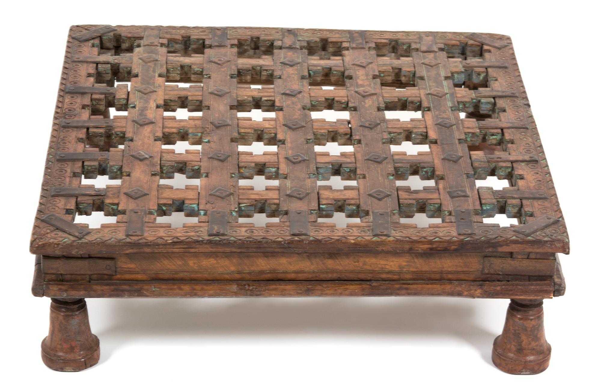 An Indian Carved Wood Low Table Height 7 x width 22 x depth 22 inches.