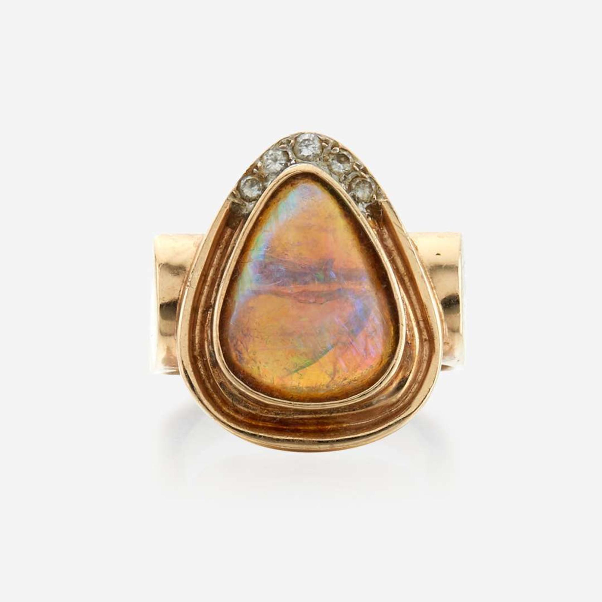 An opal, diamond, and gold ring