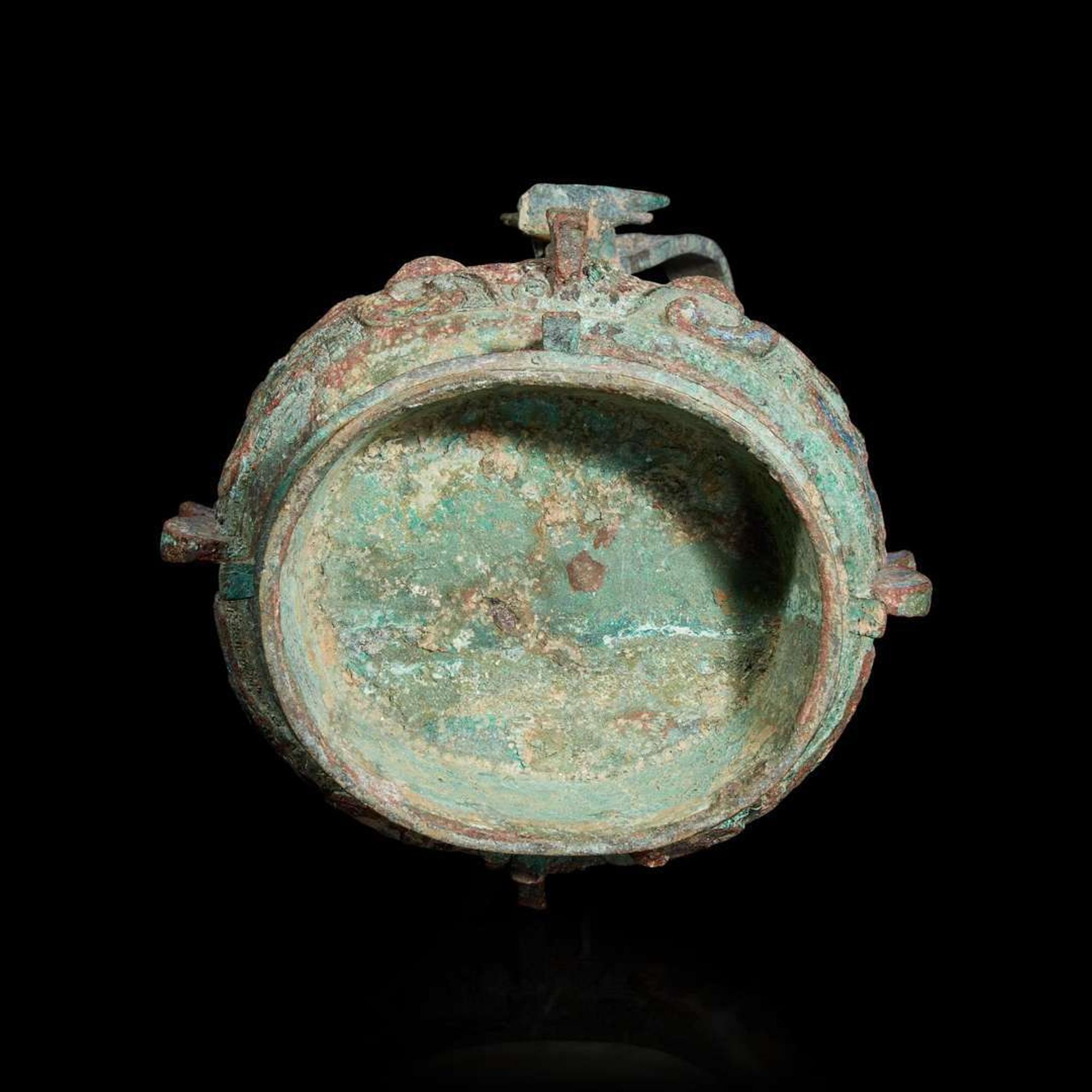 A Chinese archaistic bronze covered ritual wine vessel, You 青銅提梁卣