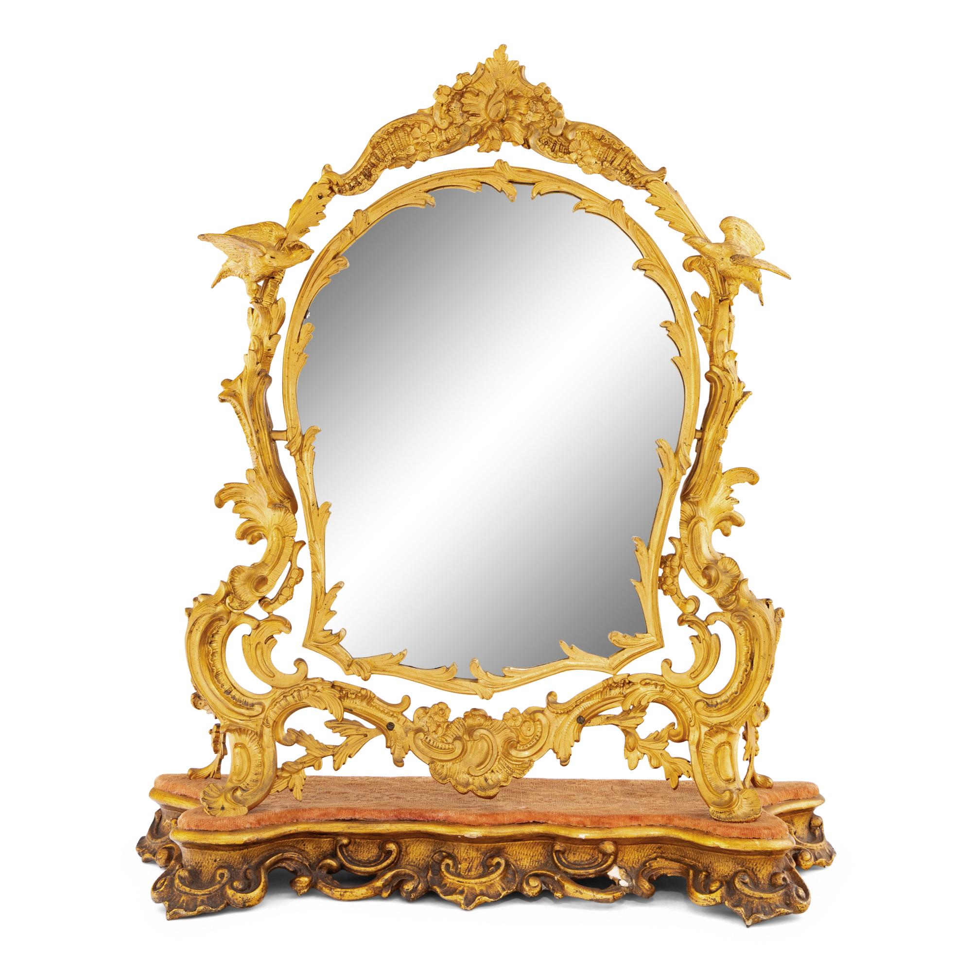 A Rococo Revival Gilt Bronze and Giltwood Dressing Mirror