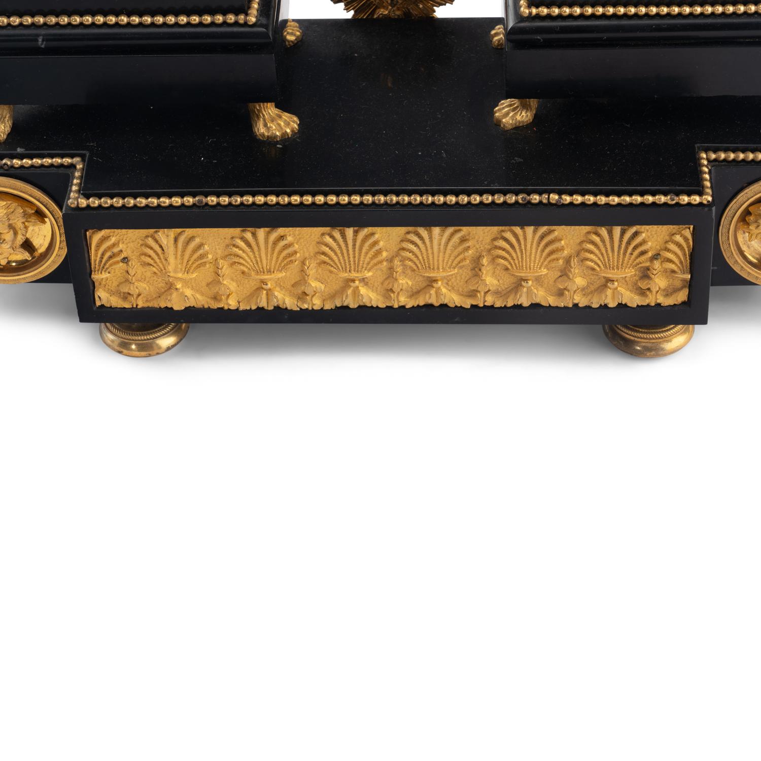 An Empire Ormolu, Black Granite and Patinated Bronze Mantel Clock