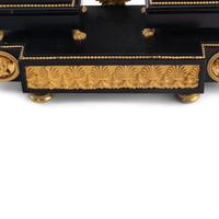 An Empire Ormolu, Black Granite and Patinated Bronze Mantel Clock