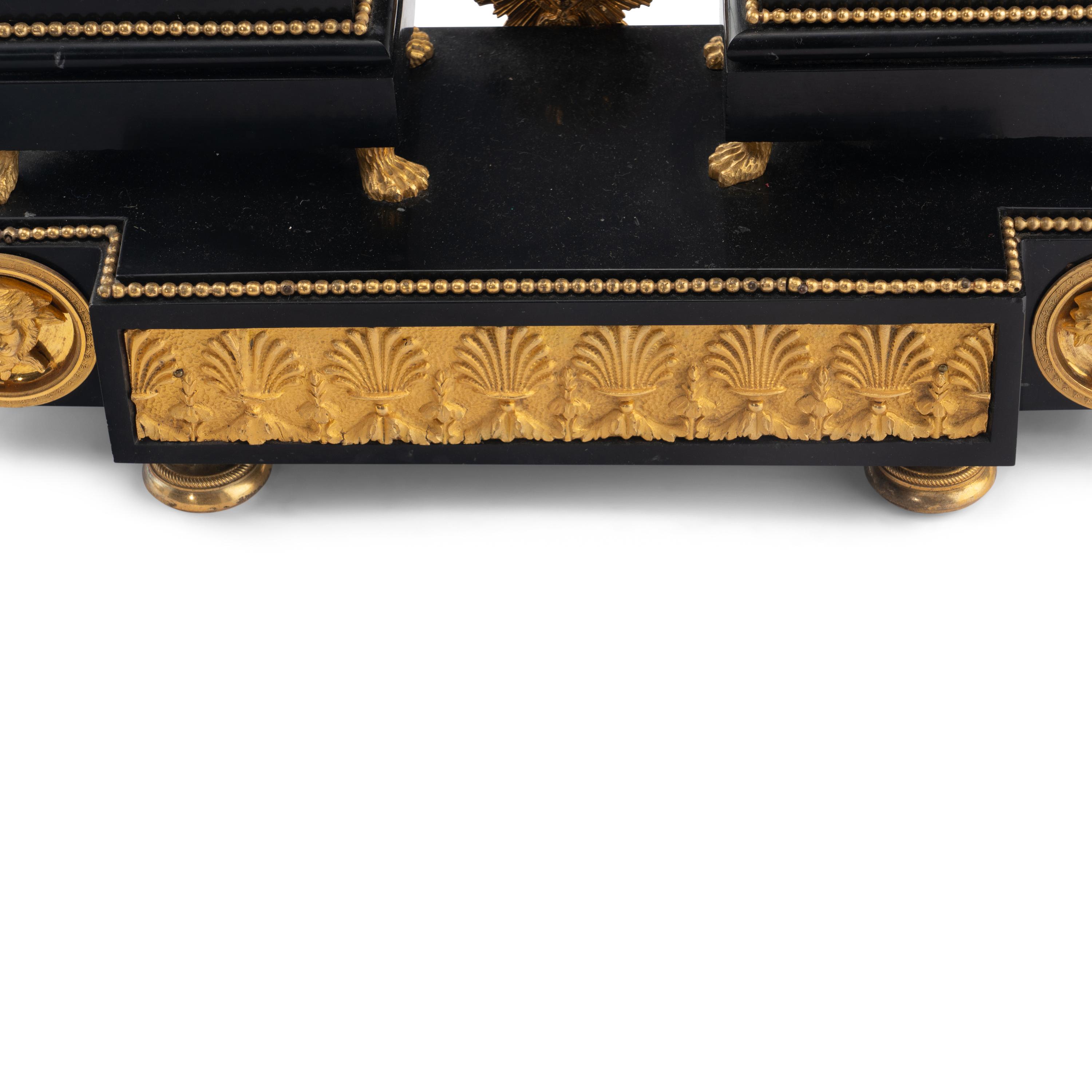 An Empire Ormolu, Black Granite and Patinated Bronze Mantel Clock