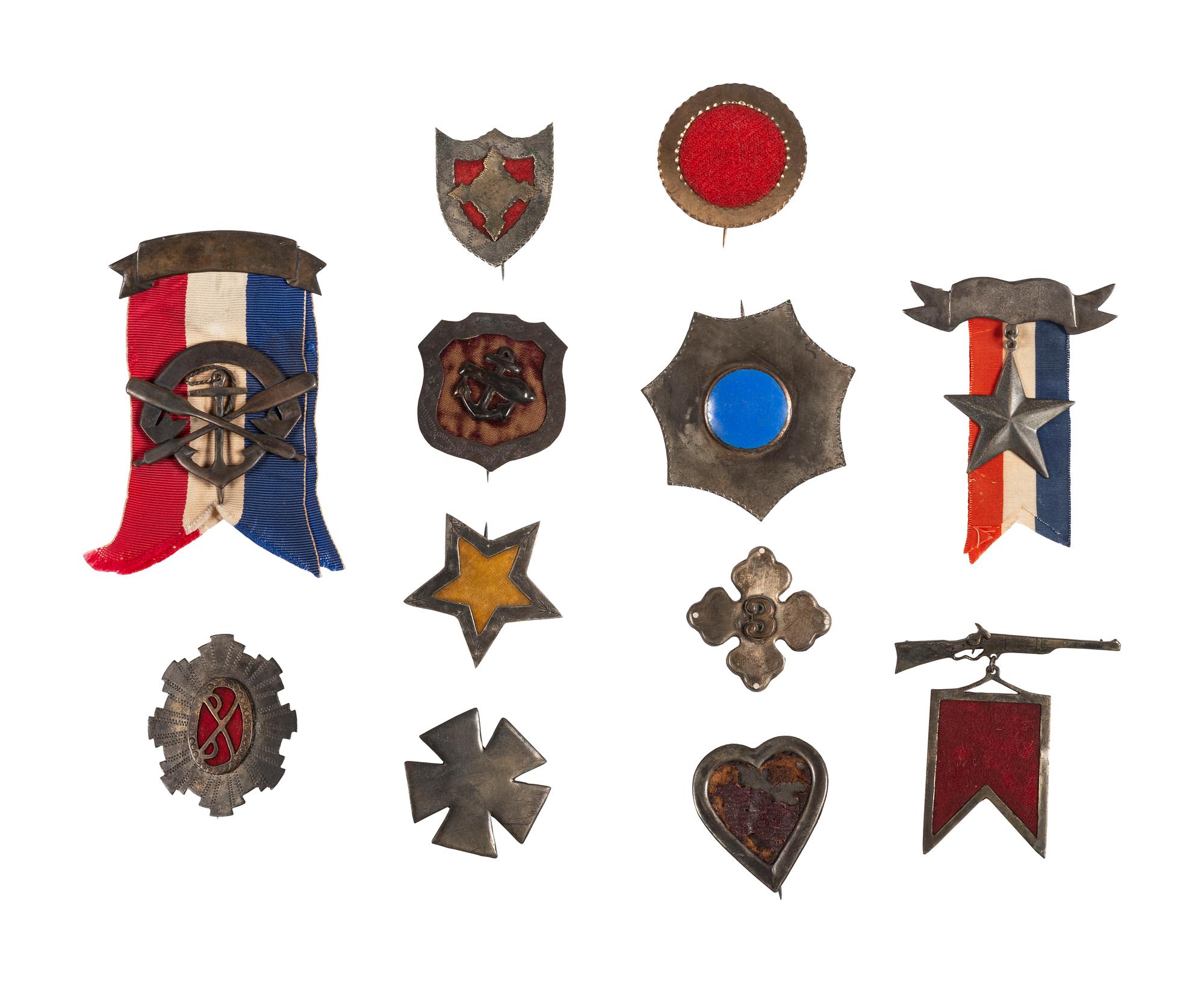 A group of 12 reproduction/fantasy corps badges collected for educational purposes, including:
