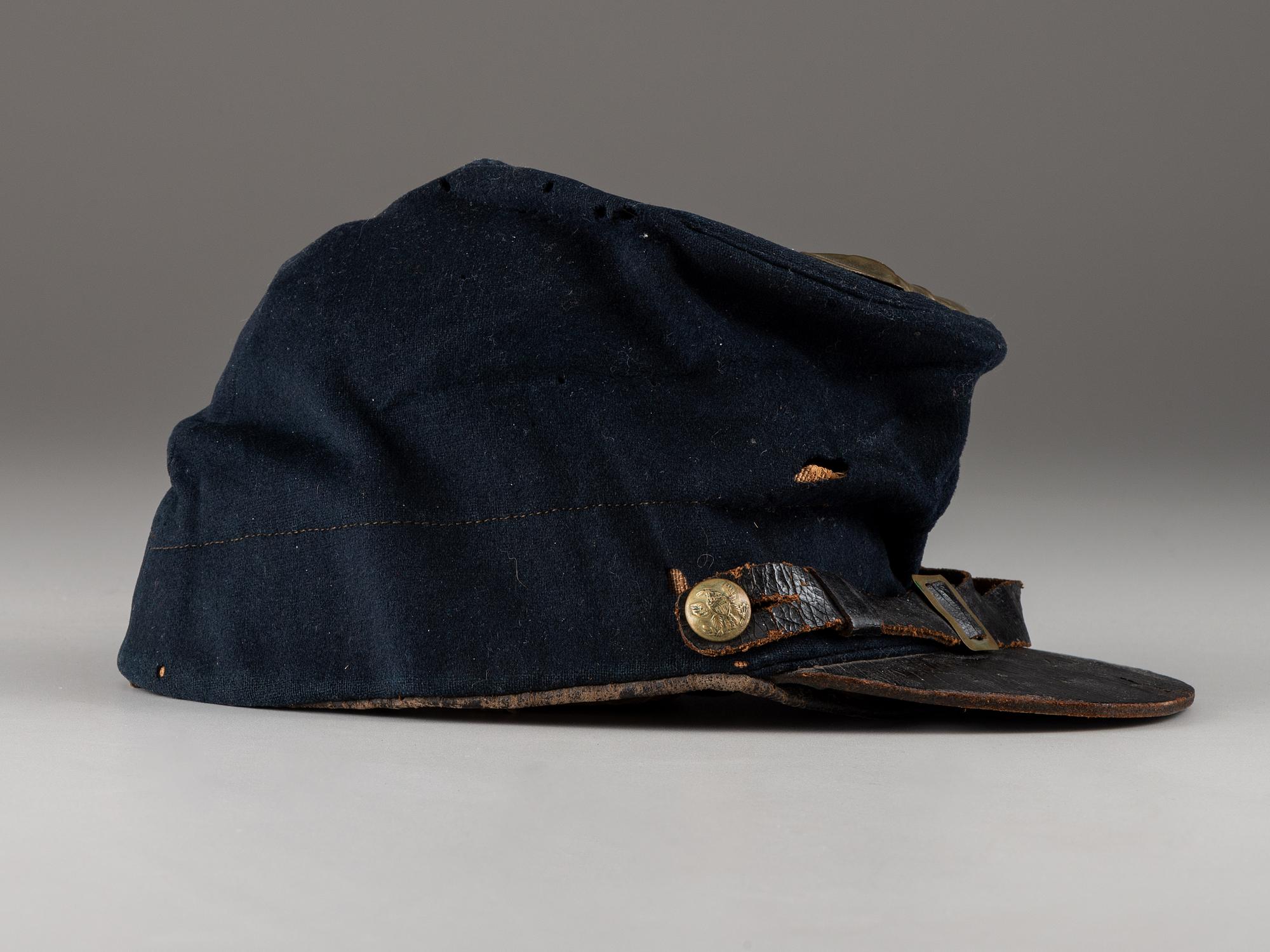 [CIVIL WAR]. Company C, 179th Pennsylvania 1858 forage cap, with identification to J.K. Hunsleker carved into visor.