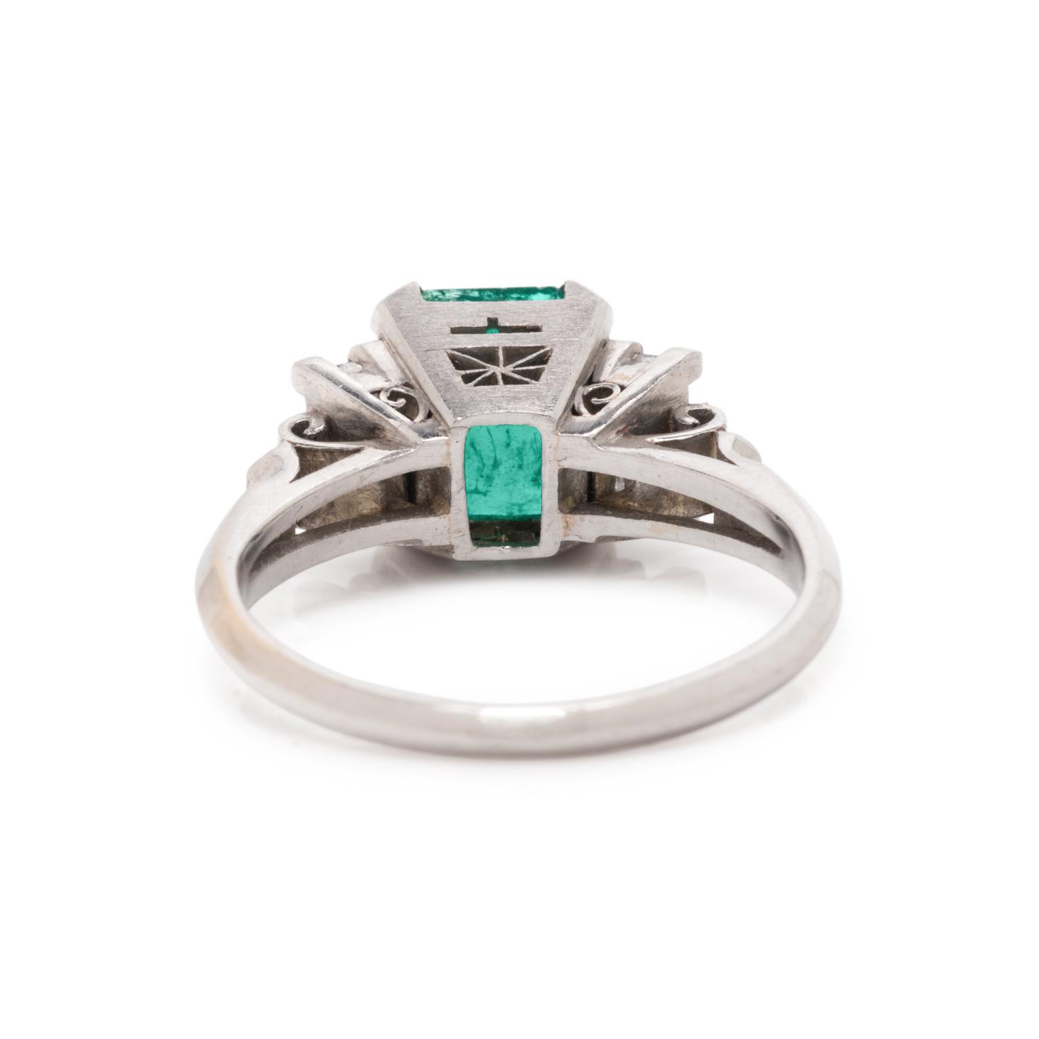 PLATINUM, EMERALD, AND DIAMOND RING