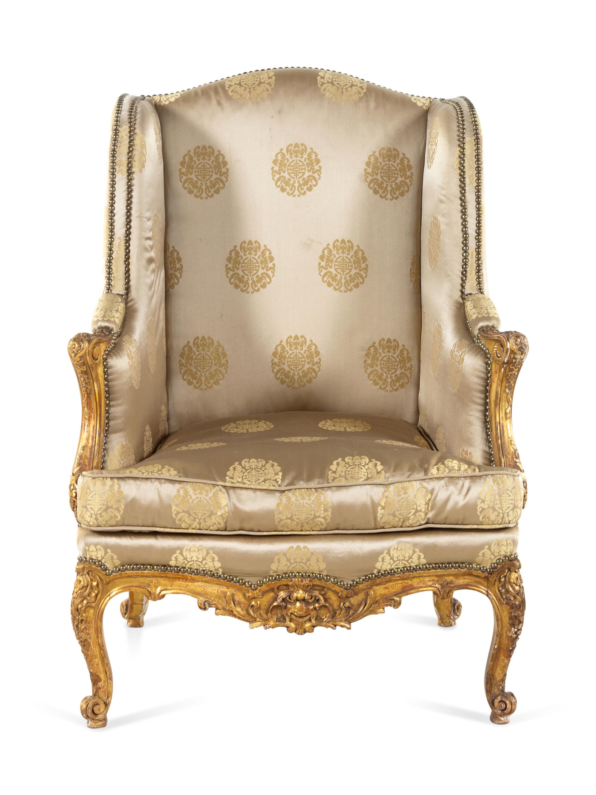 A Louis XV Style Carved Giltwood Bergère à Oreilles