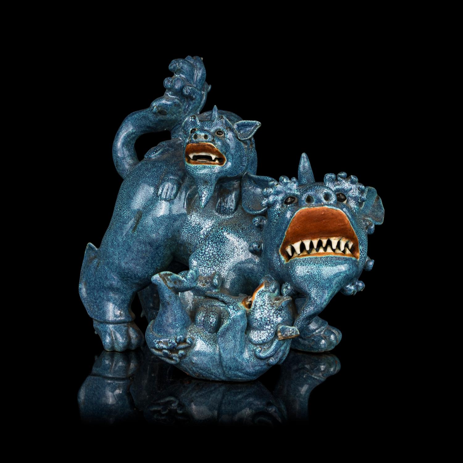 A Chinese Robin's Egg Glazed Porcelain Figural Group of Fu Lions