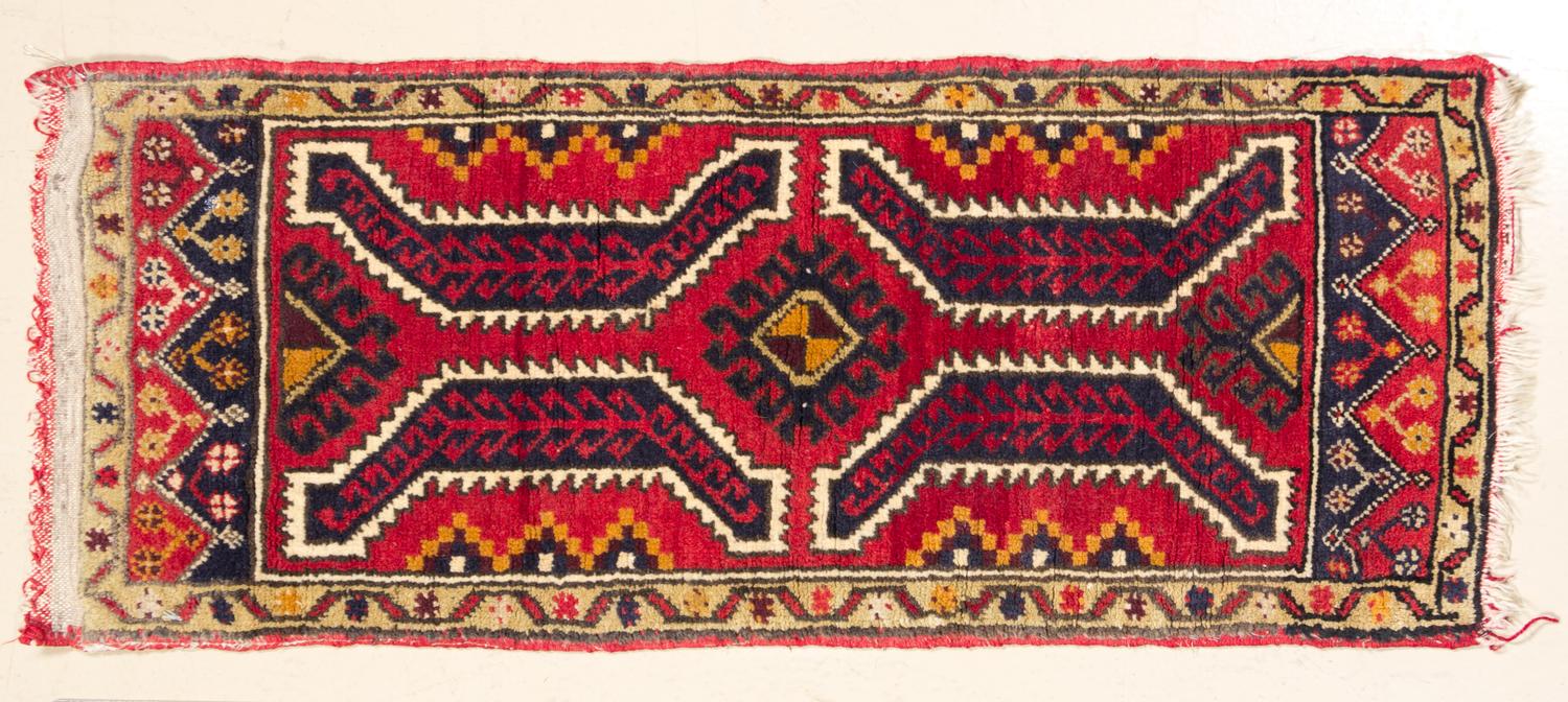 A Northwest Persian Mat 3 feet 3 inches x 1 foot 6 inches.