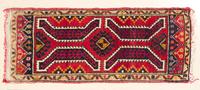 A Northwest Persian Mat 3 feet 3 inches x 1 foot 6 inches.