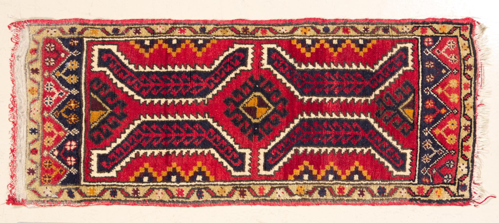 A Northwest Persian Mat 3 feet 3 inches x 1 foot 6 inches.