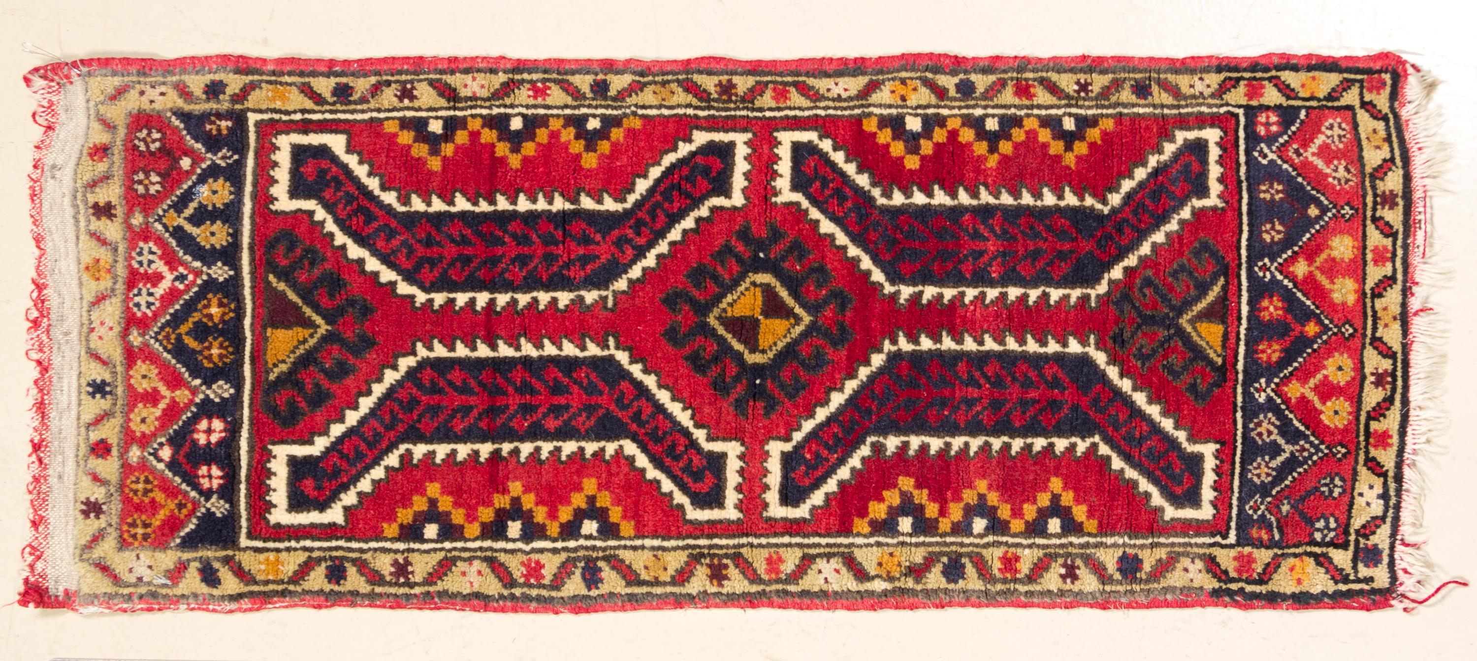 A Northwest Persian Mat 3 feet 3 inches x 1 foot 6 inches.