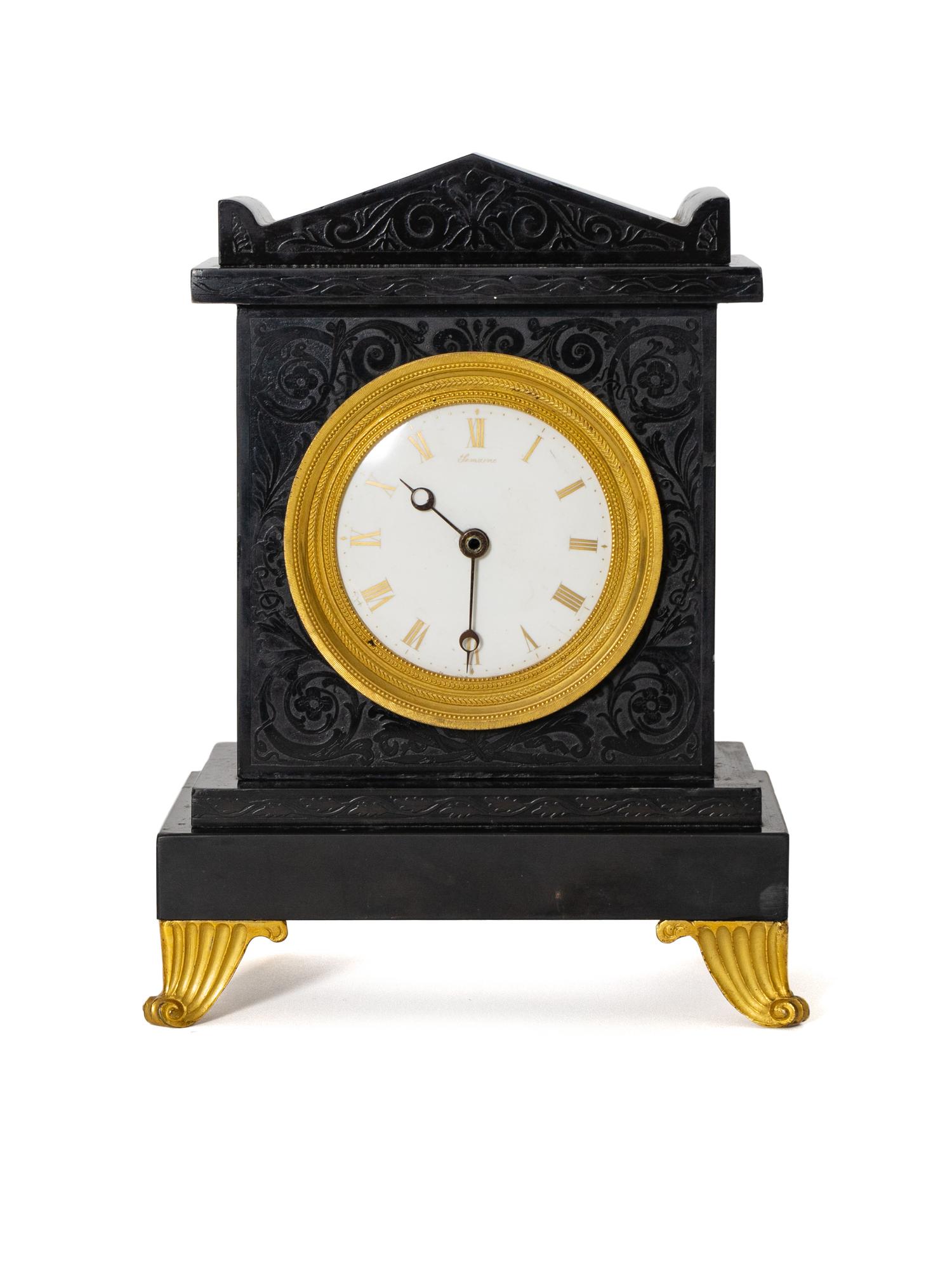 A Regency Black Slate and Gilt Bronze Mantel Clock