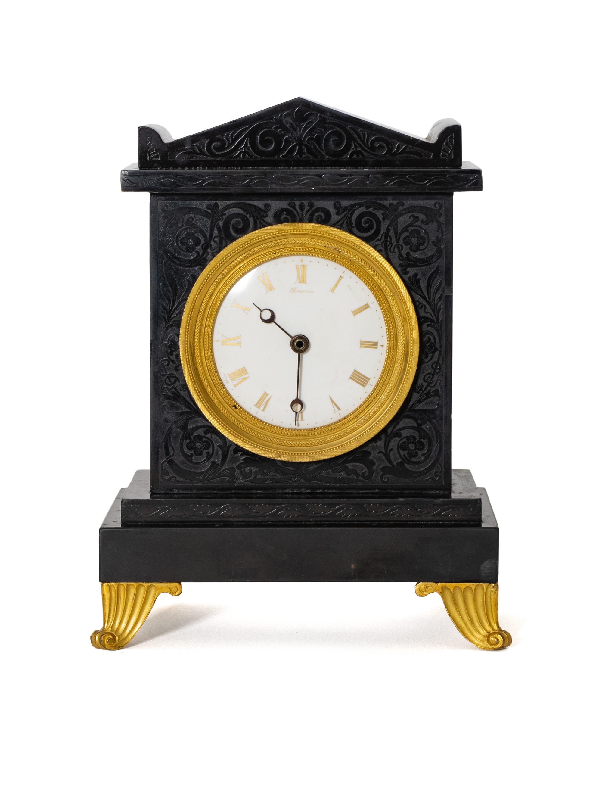 A Regency Black Slate and Gilt Bronze Mantel Clock