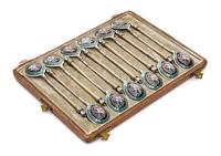A Set of Twelve Russian Silver and Enamel Teaspoons, Maker's mark obscured, assay mark of Viktor Savinsky, Moscow, 1878, having twist h