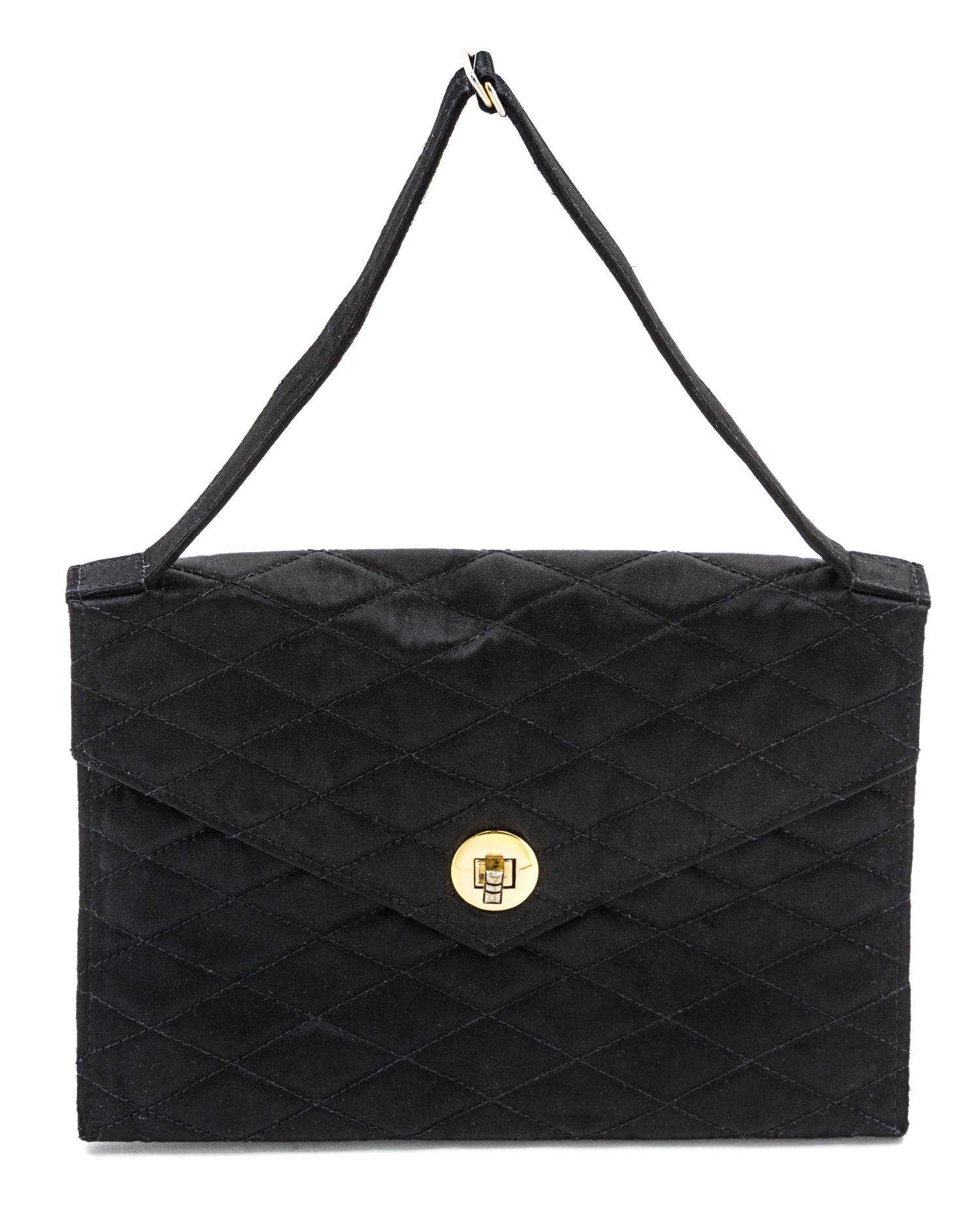 A Chanel Black Satin Quilted Evening Bag, 8 1/2 x 6 x 1 inches.