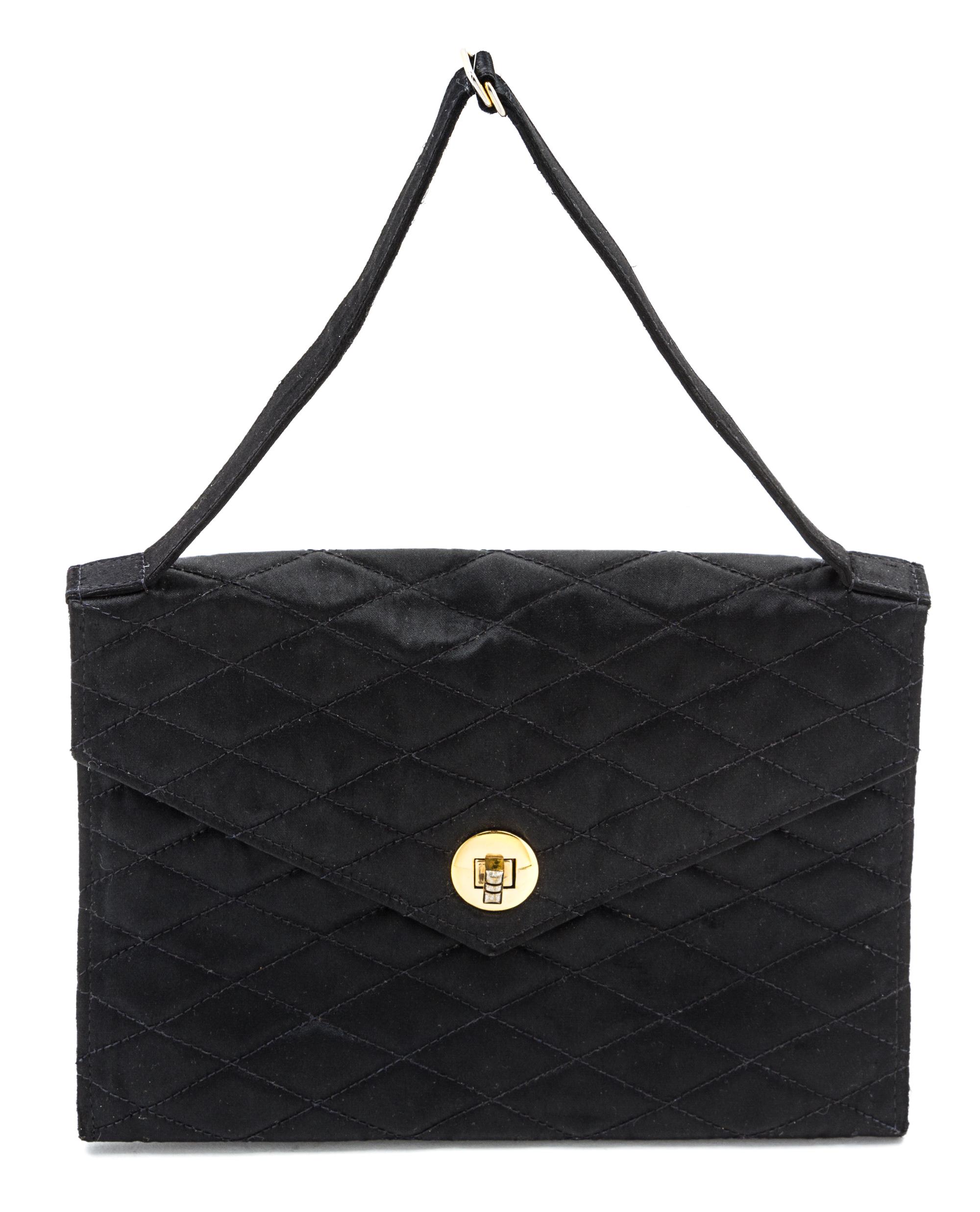 A Chanel Black Satin Quilted Evening Bag, 8 1/2 x 6 x 1 inches.
