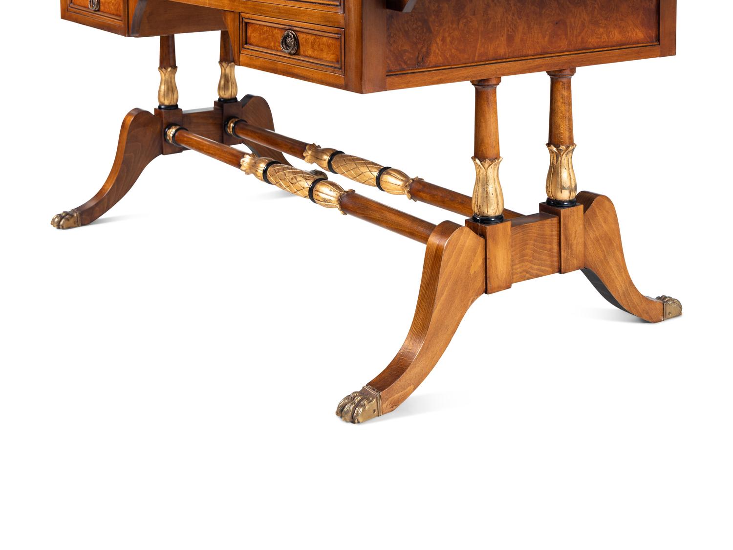 A Regency Style Parcel-Gilt and Part-Ebonized Mahogany Sofa Table