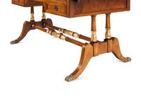 A Regency Style Parcel-Gilt and Part-Ebonized Mahogany Sofa Table