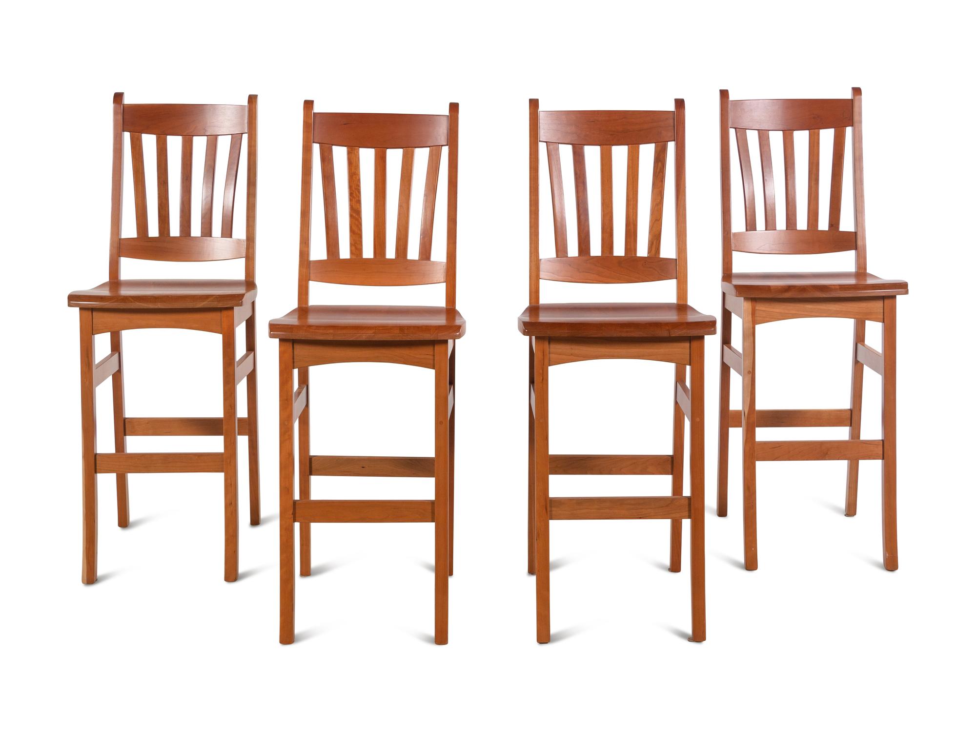 A Set of Four Arts and Crafts Style Bar Seats