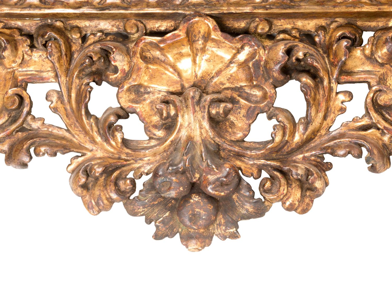A Florentine Rococo Revival Carved Giltwood Overmantel Mirror