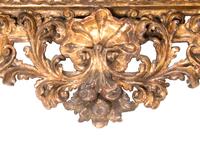 A Florentine Rococo Revival Carved Giltwood Overmantel Mirror