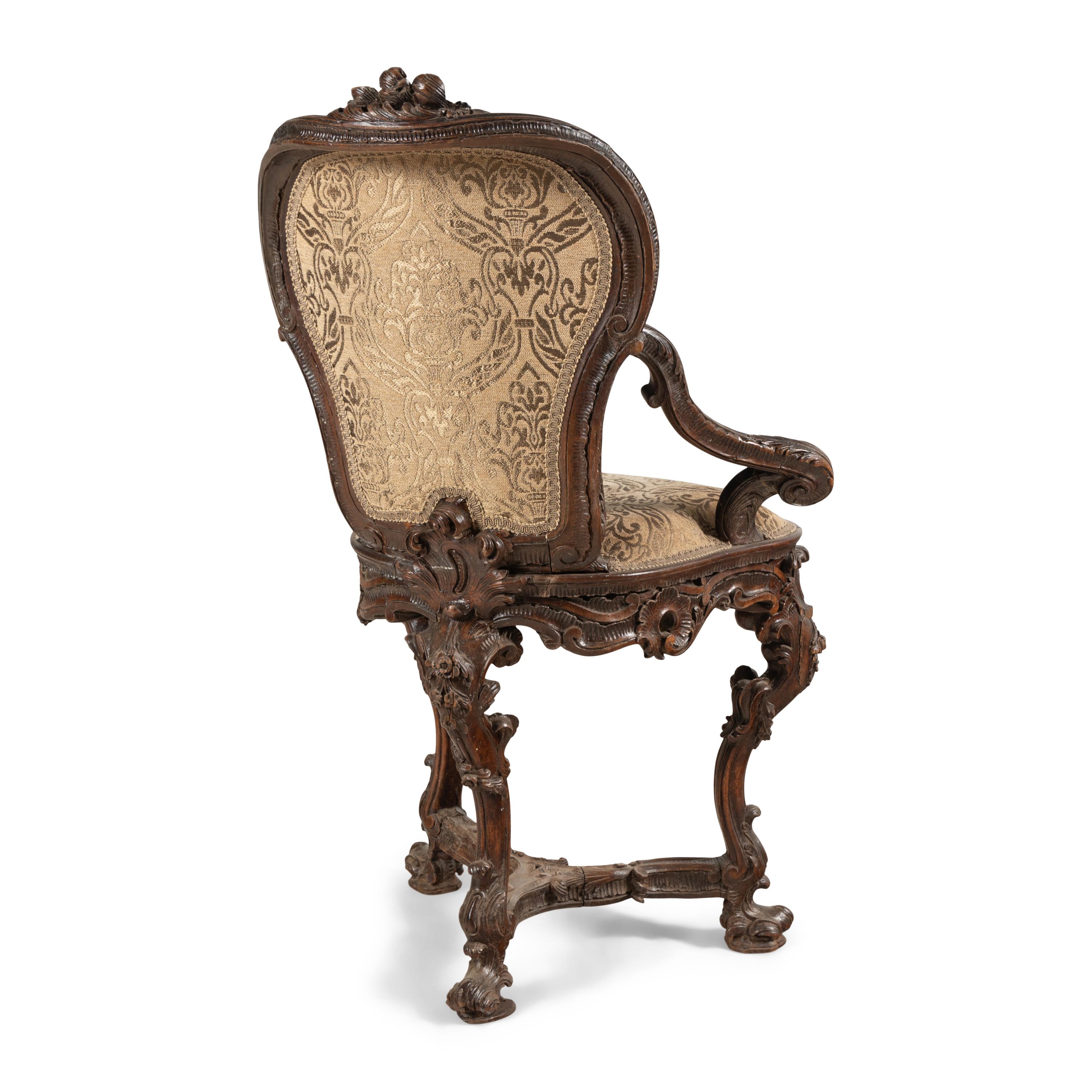 A Venetian Carved Walnut Armchair