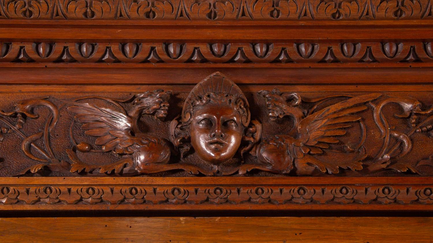 An Italian Renaissance Style Carved Walnut Cabinet