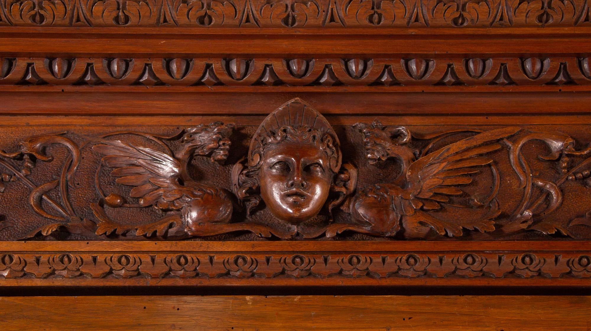 An Italian Renaissance Style Carved Walnut Cabinet
