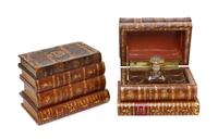 A Pair of French Book Form Decanter Sets, Height of tallest 5 1/4 x width 7 1/8 x depth 4 3/4 inches.