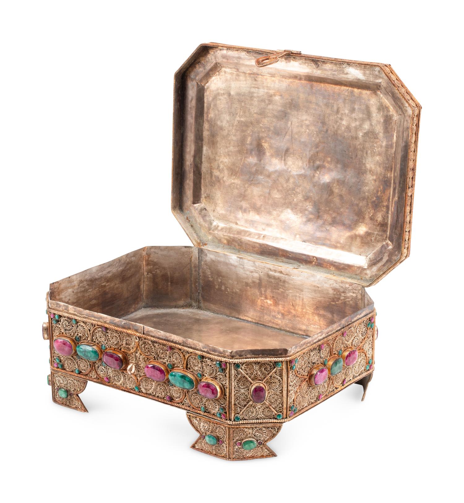 An Emerald and Ruby Mounted Silvered Metal Filigree Box