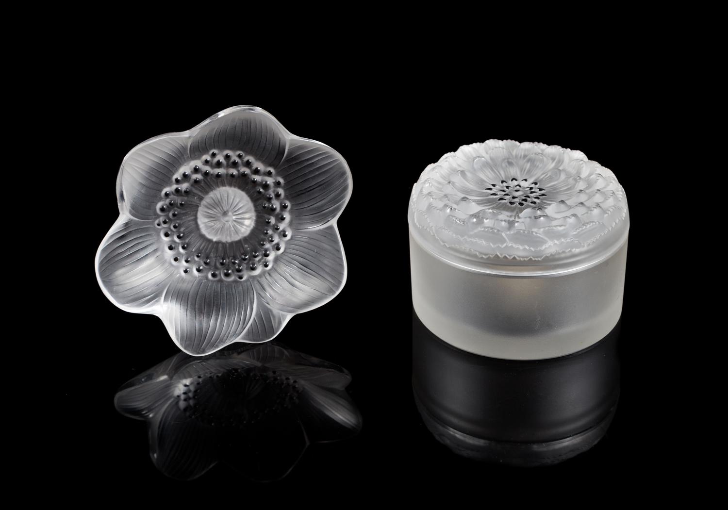 Lalique, a pair of molded and frosted glass Anemone figural articles, comprising a paper weight and a box