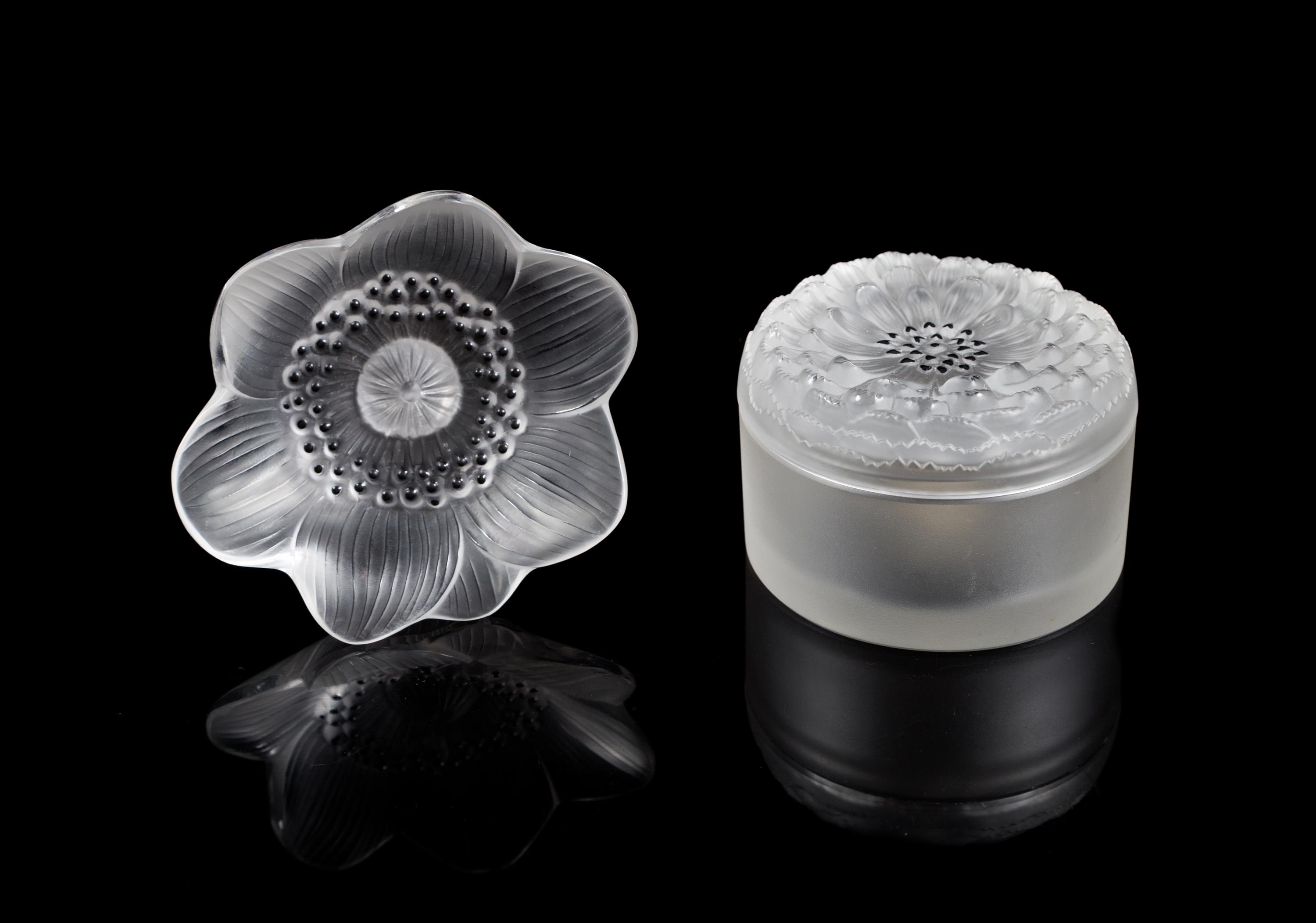 Lalique, a pair of molded and frosted glass Anemone figural articles, comprising a paper weight and a box