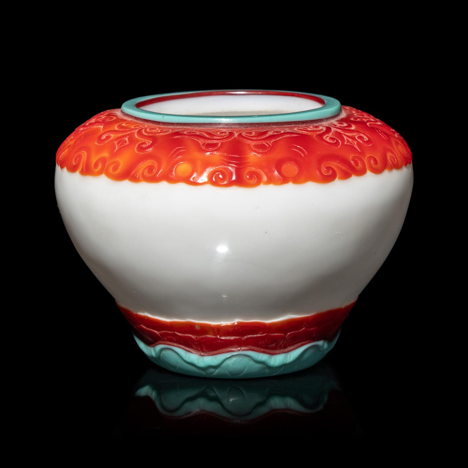A Chinese Turquoise and Ruby Overlay White Glass Water Pot, Qianlong Mark and Period 清乾隆 白地套彩料饕餮蓮紋水盂