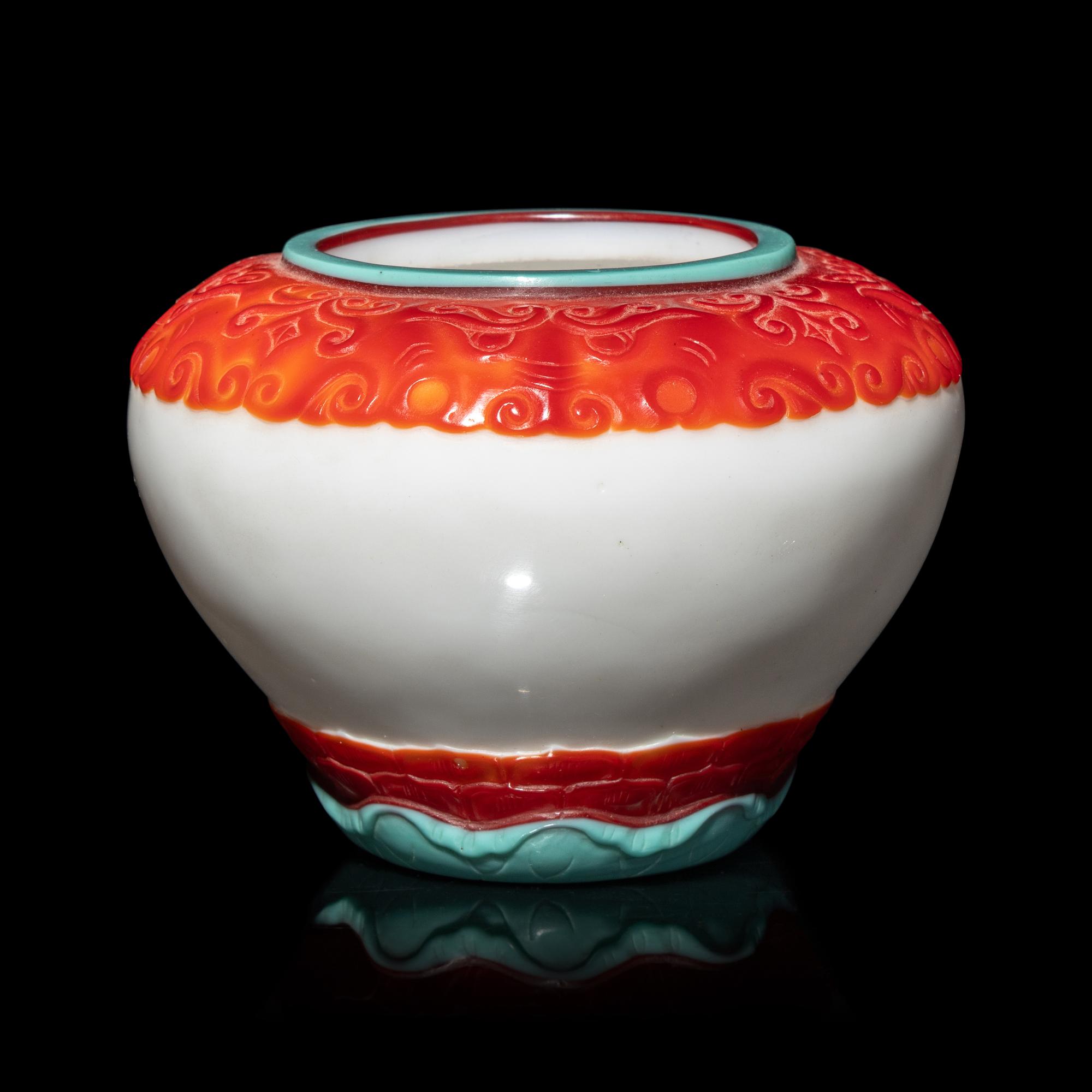A Chinese Turquoise and Ruby Overlay White Glass Water Pot, Qianlong Mark and Period 清乾隆 白地套彩料饕餮蓮紋水盂