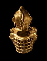 A Tairona Tumbaga Seated Female Figure