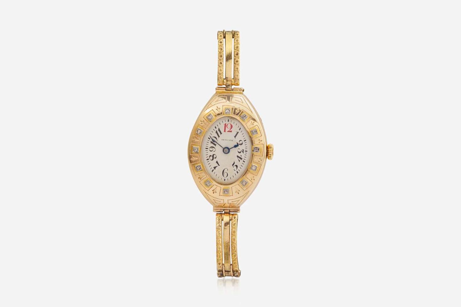 A Ladies 14K Yellow Gold Russian Invicta Watch with Diamonds