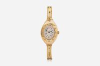 A Ladies 14K Yellow Gold Russian Invicta Watch with Diamonds
