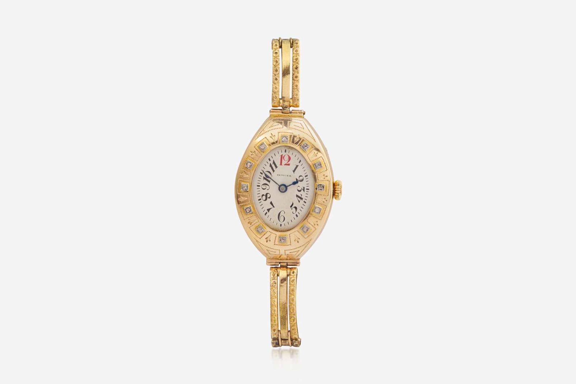 A Ladies 14K Yellow Gold Russian Invicta Watch with Diamonds